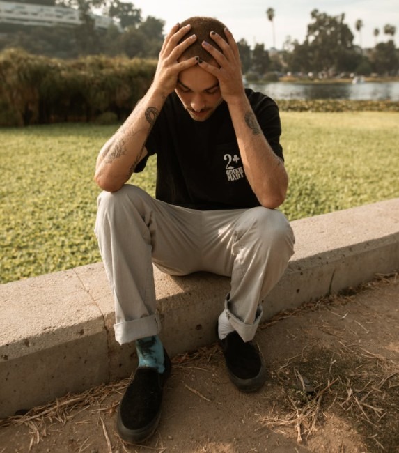 A person holding their head