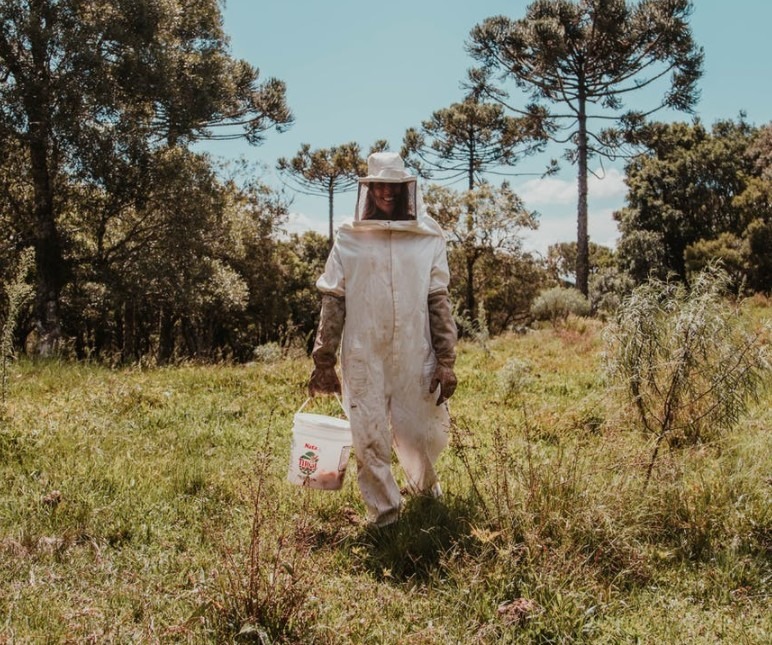 A woman wearing a full protective gear suit