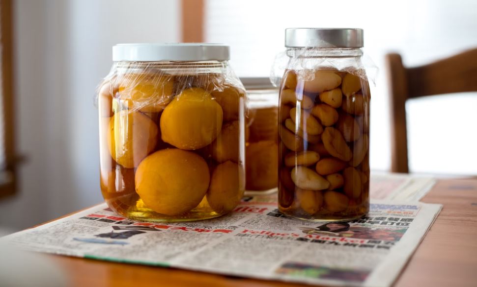 three jars on top of a newspaper