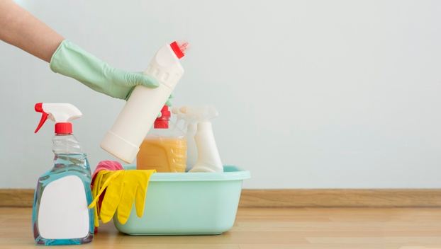 Front view of cleaning supplies in a bucket