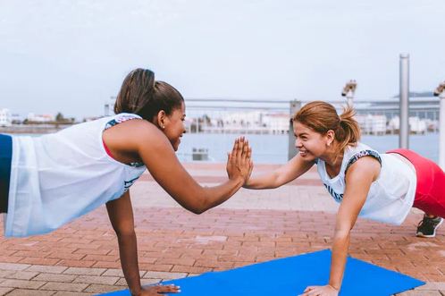 2 women doing exercise