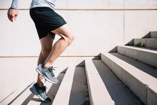 A picture of a man exercising on stairs.