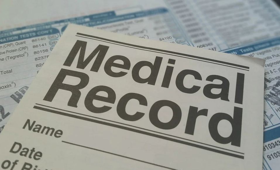 a hardcopy of medical record form with name and date of birth.