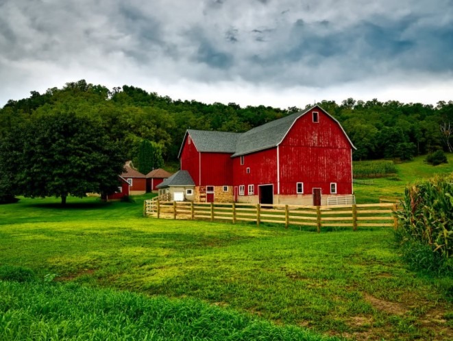 A red barn with fencing around it
