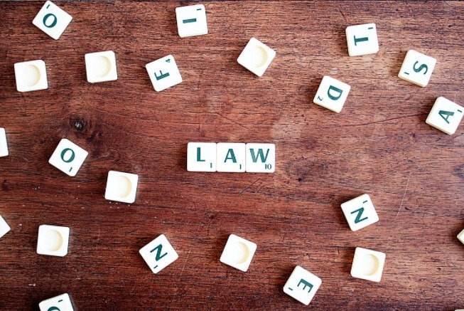 “Law” spelled out with scrabble tiles