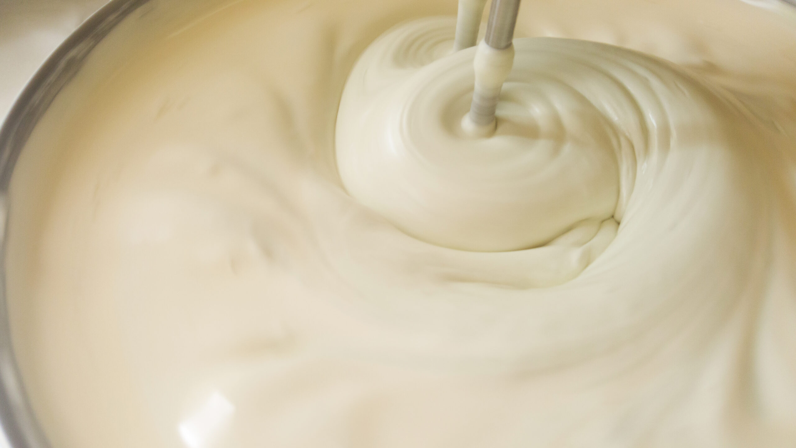 mixing batter in a bowl image
