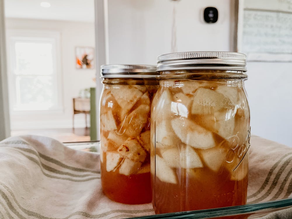 a mason jar with preserved apples